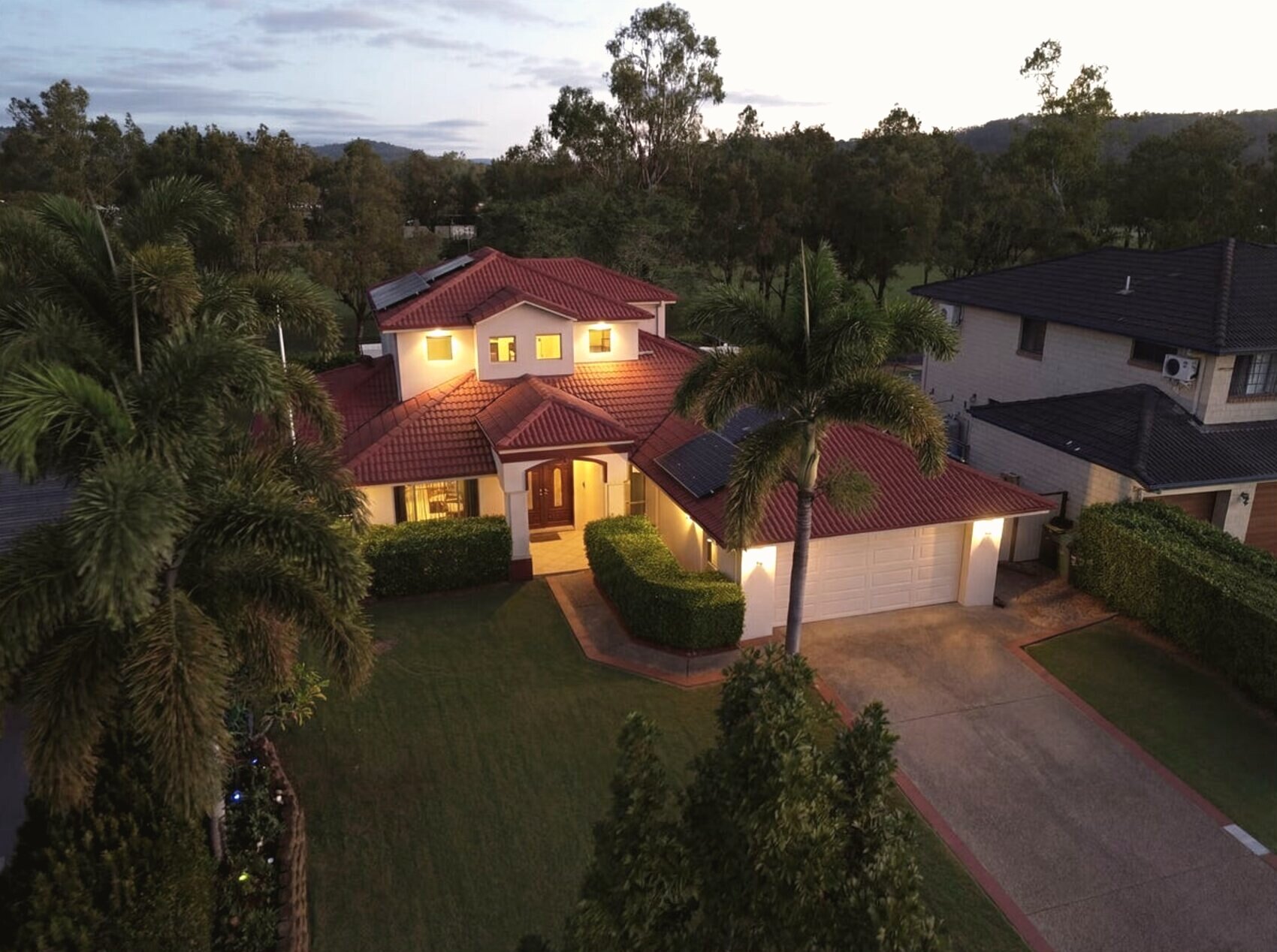 Aerial of a family residence at dusk, Windaroo